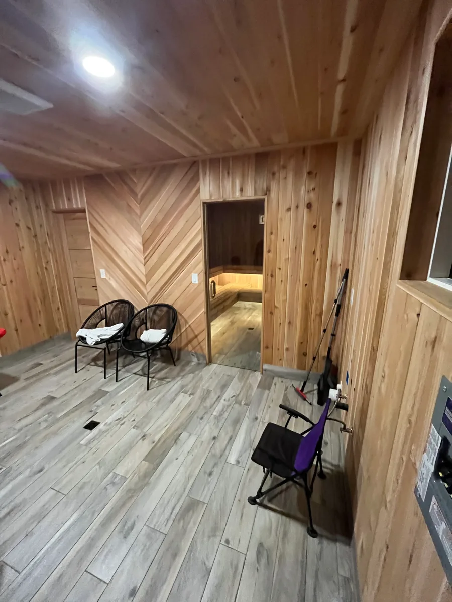 Luxury vinyl plank flooring in a cedar-panelled bonus room