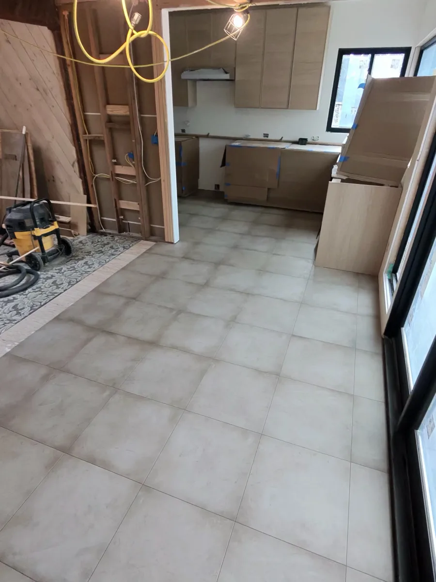 Large-format tile flooring in a kitchen remodel